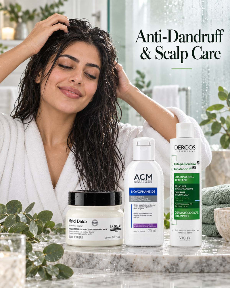 Woman washing her hair alongside anti-dandruff and scalp care shampoos including Vichy Dercos Technique Anti-Dandruff DS Shampoo, Clary Hair Fall Control Anti-Dandruff Shampoo, ACM Novophane.DS Anti-Dandruff Shampoo, and L'Oréal Professionnel Metal Detox Shampoo.